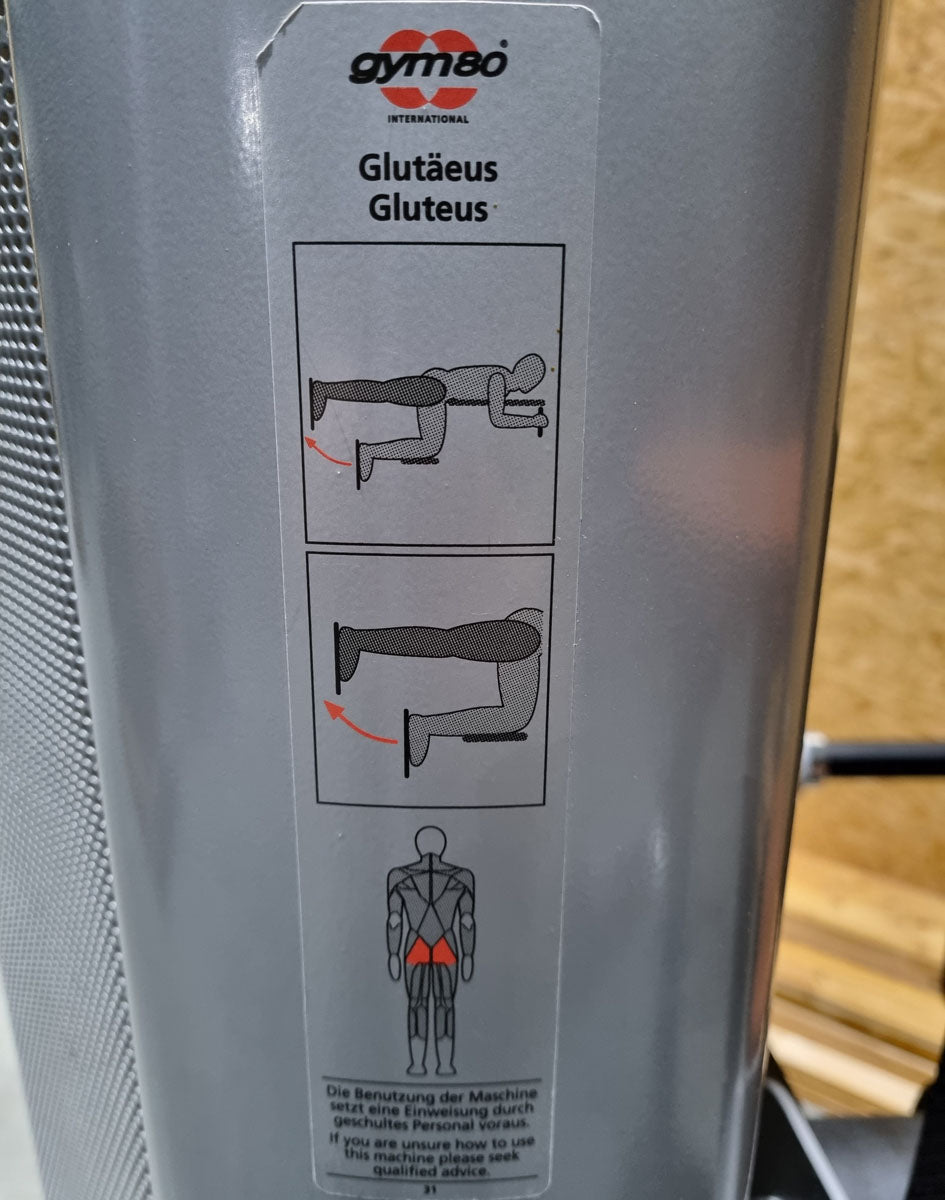 Gym80 Gluteus Kick Knieend 3004 Sygnum, Pomaschine, Rahmenfarbe Silber, Polsterfarbe Orange, gebraucht - überholter Zustand