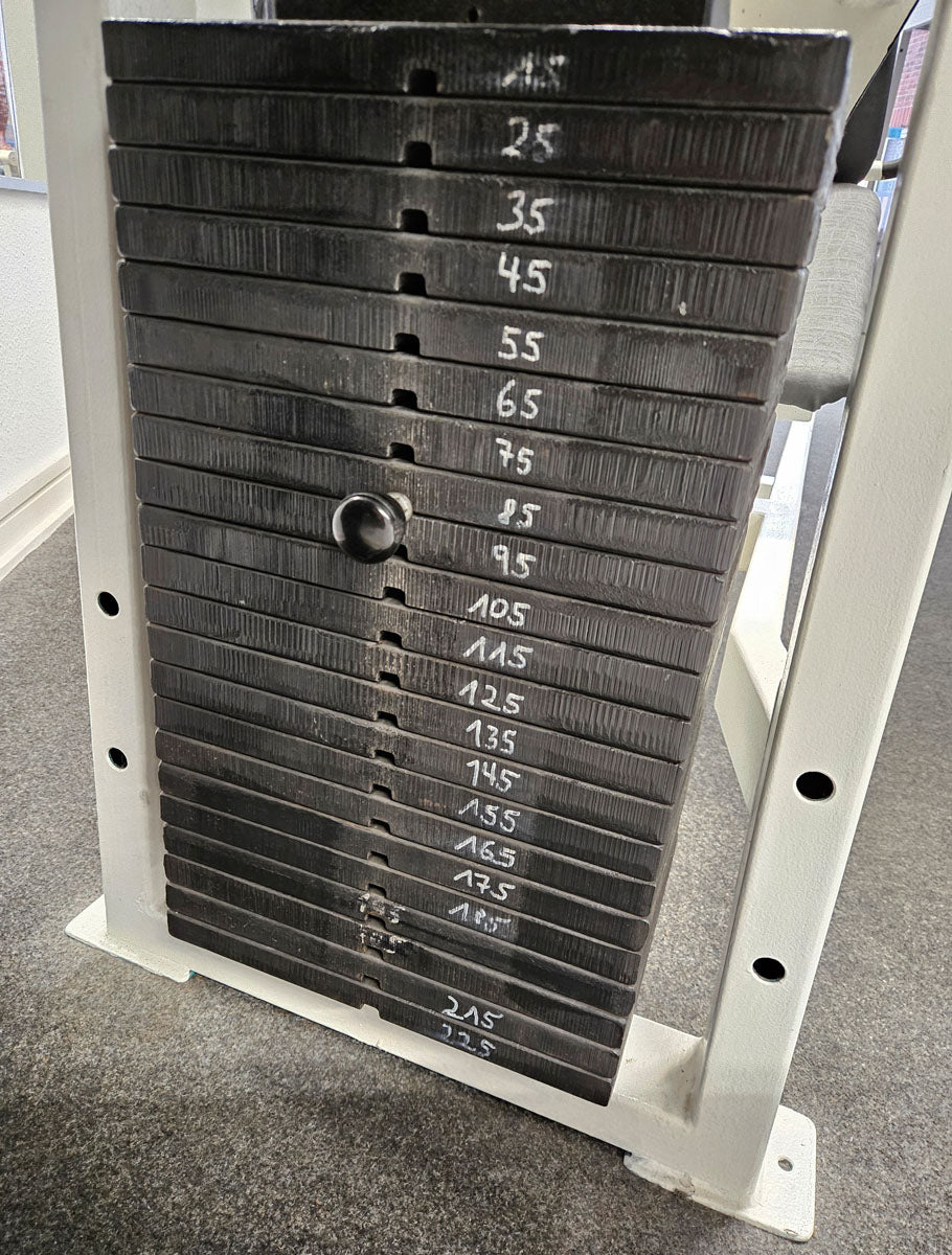 Old school leg press, 225kg weight block, manufacturer probably Gym80 or L+K or Galaxy, bodybuilding strength equipment - frame color white, used with signs of wear