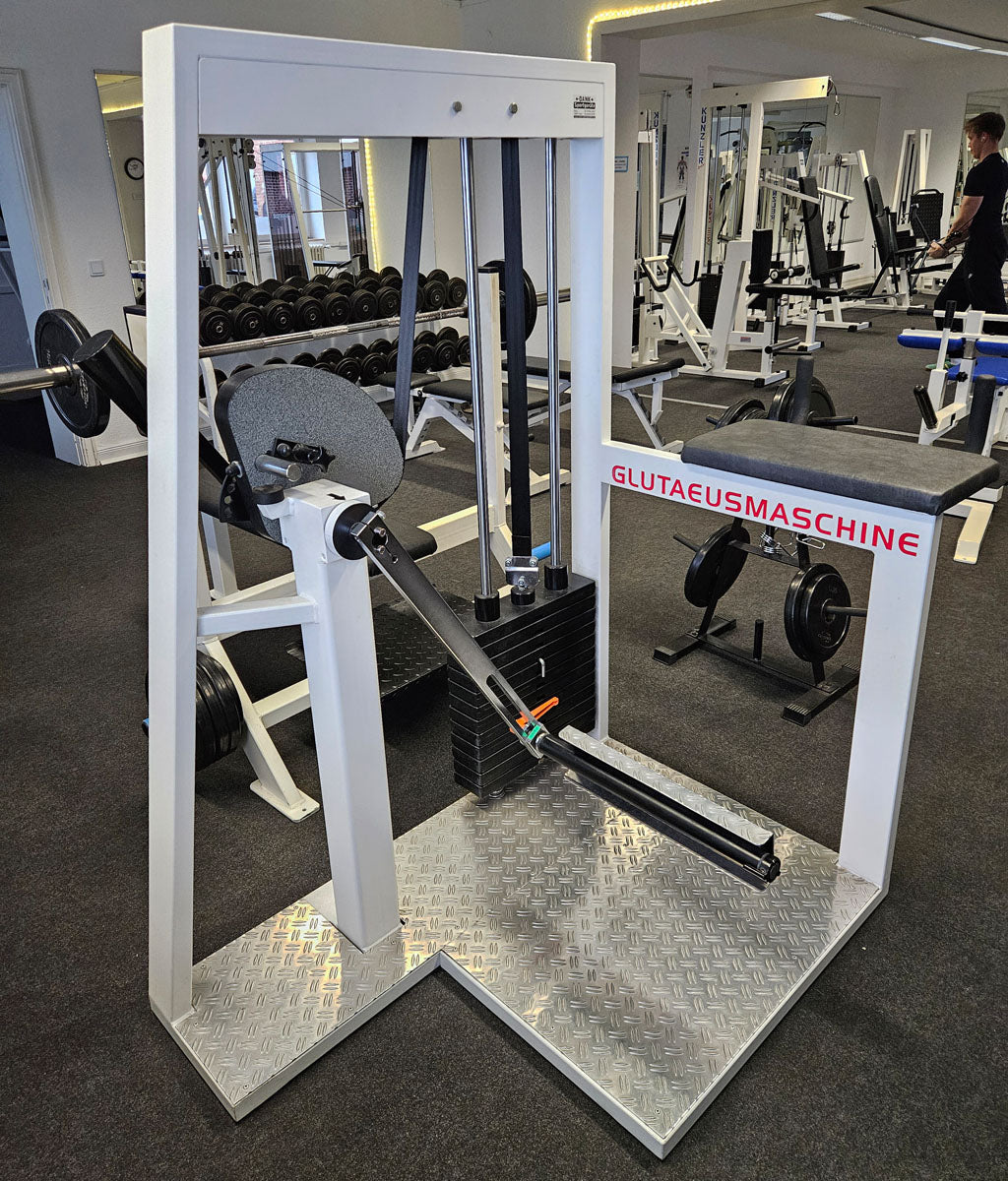 Joschko Pomaschine, Gluteusmaschine stehend, verstellbar, Glute, Rahmenfarbe Weiß, gebraucht - geprüfter Zustand mit kleinen Gebrauchsspuren