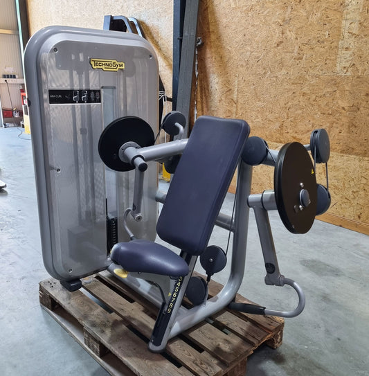 TechnoGym Biceps Machine, Arm Curl, Element Line, frame color silver, upholstery color dove blue, used - refurbished condition