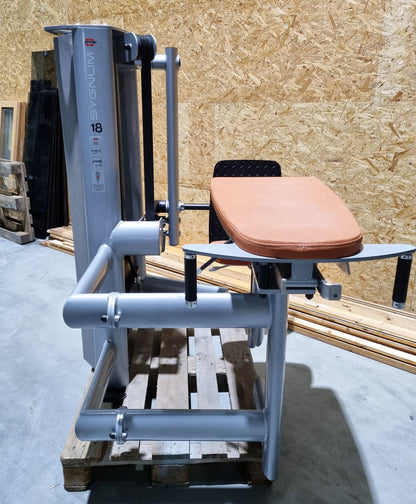 Gym80 Gluteus Kick Kneeling 3004 Sygnum, butt machine, frame color silver, upholstery color orange, used - refurbished condition