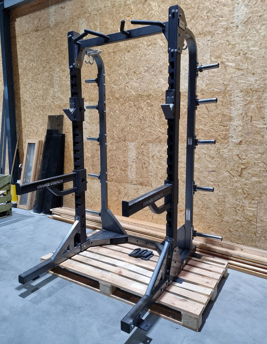 Hammer Strength HD Elite Half Rack with wooden floor and pull-up bar, frame color black, used - refurbished condition