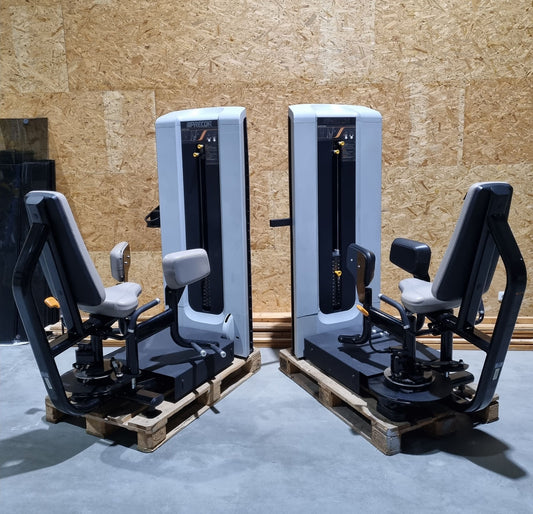 Precor adductor and abductor strength training equipment with weights in a set as a pair, frame color black, upholstery color gray, used - refurbished condition