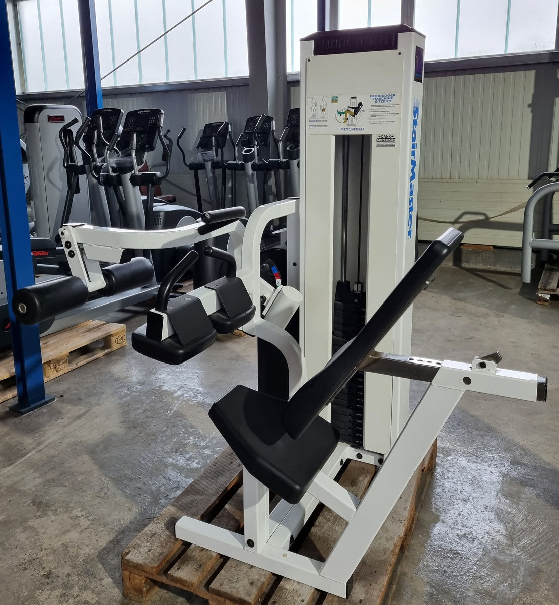 Stairmaster leg curl, seated, white, used, Pacific