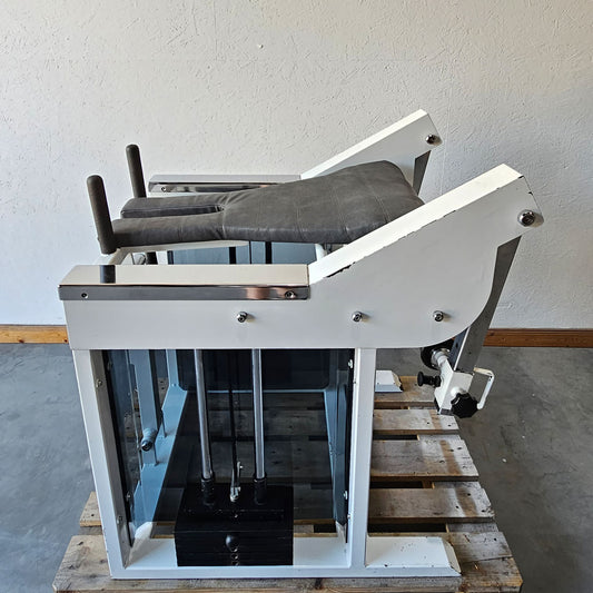 Bruns buttock machine, standing glute machine, glute isolator raise, old school bodybuilding strength machine, white frame, used with signs of wear