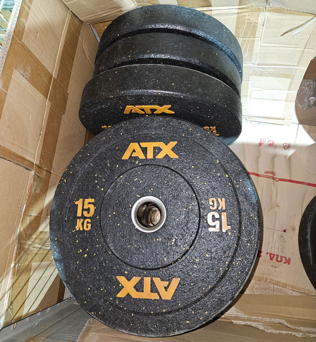 Set 230kg Bumper Plates von ATX - 2x 25kg, 4x 20kg, 4x 15kg, 4x 10kg, Hantelscheiben 50mm Durchmesser aus Granulat gepresst in Schwarz mit bunten Farbflecken, gebraucht - mit Gebrauchsspuren