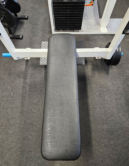 Flat press bench with shelves for bench press, bench press, old school bodybuilding, frame color white, used with signs of wear