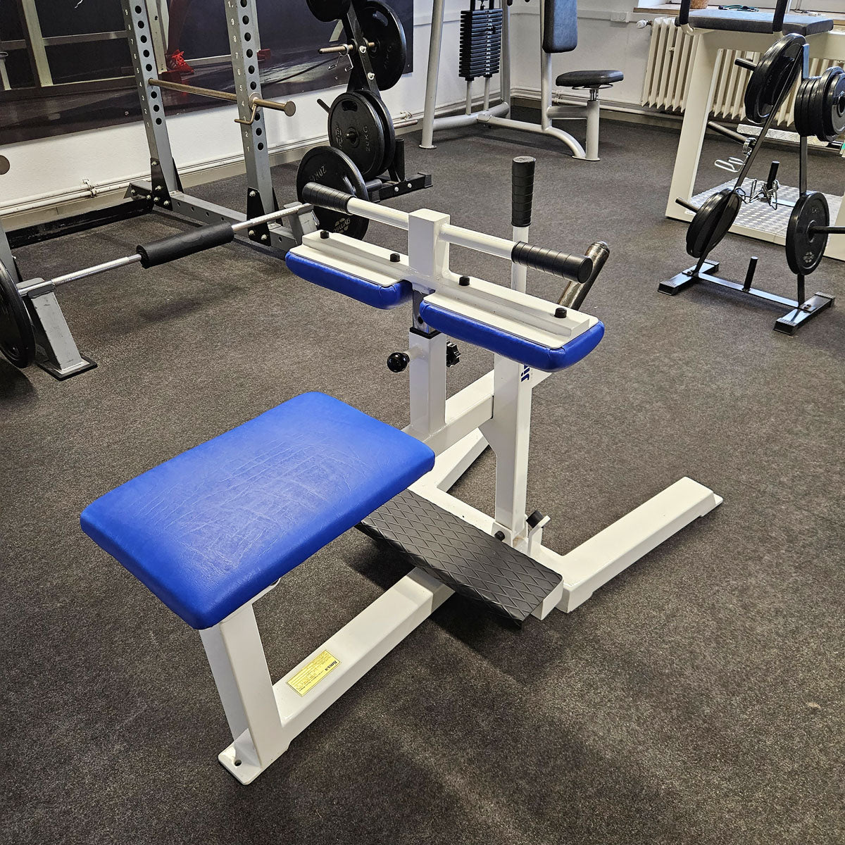 Jimsa calf machine plate loaded 50mm, seated calf raise, frame color white, used and tested with small signs of wear