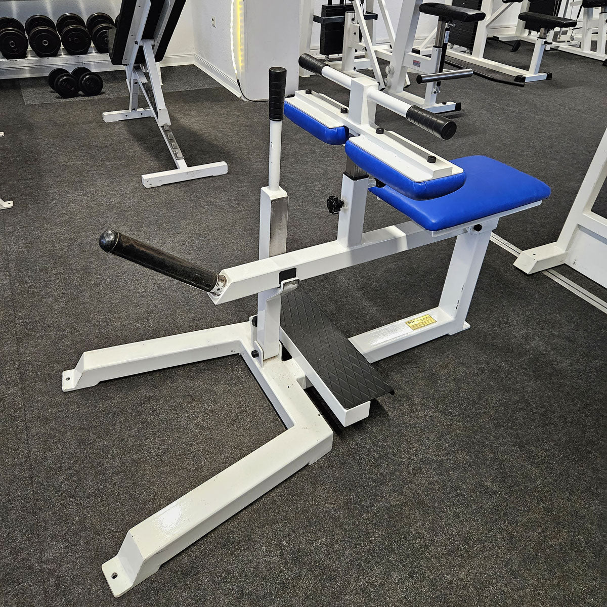 Jimsa calf machine plate loaded 50mm, seated calf raise, frame color white, used and tested with small signs of wear