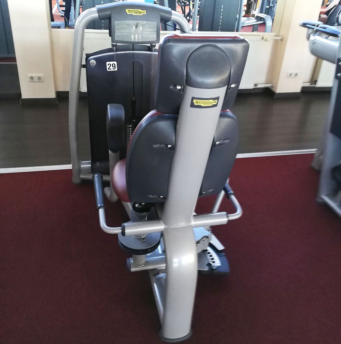 TechnoGym Abductor Machine, Hip Abductor, Selection Line - New model with plastic cover, brown upholstery, used - refurbished condition