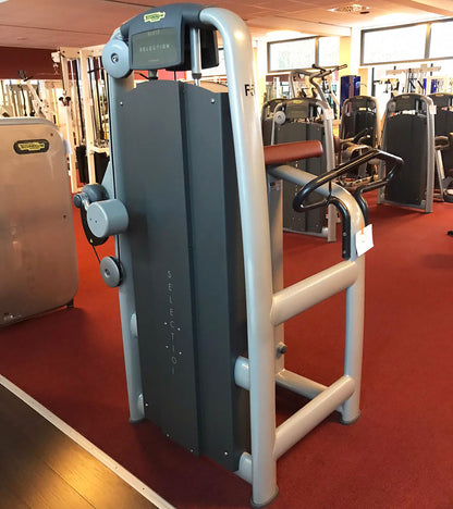 TechnoGym Gluteus Machine, Glute, Selection Line - New model with plastic cover, brown upholstery, used - refurbished condition