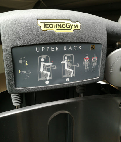 TechnoGym Upper Back, Rowing Row, Lat Isolator, Selection Line - New model with plastic cover, brown upholstery, used - refurbished condition