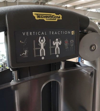 TechnoGym Lat Pulldown, Vertical Traction, Pulldown, Selection Line - New model with plastic cover, brown upholstery, used - refurbished condition