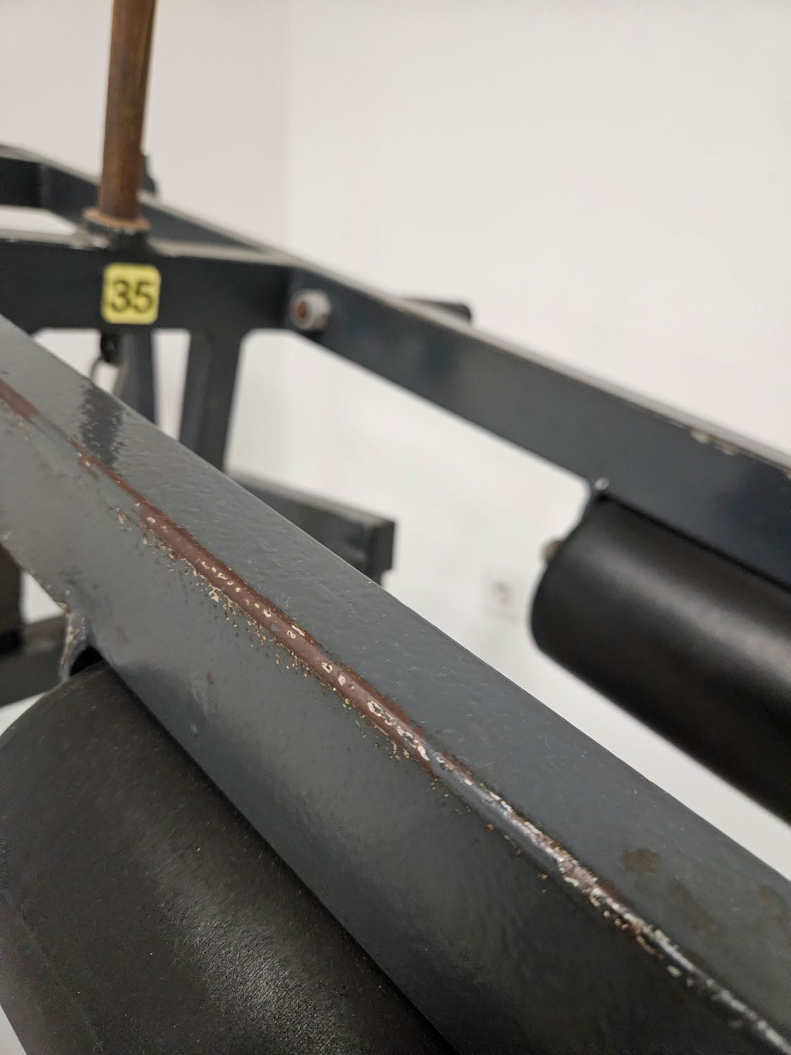 Calf machine standing, 180kg plug-in weights + holder for weight plates, old-school bodybuilding strength equipment, used with signs of wear